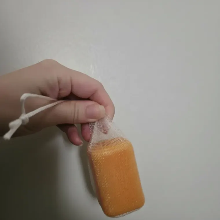 Customer holding the sana persimmon soap box